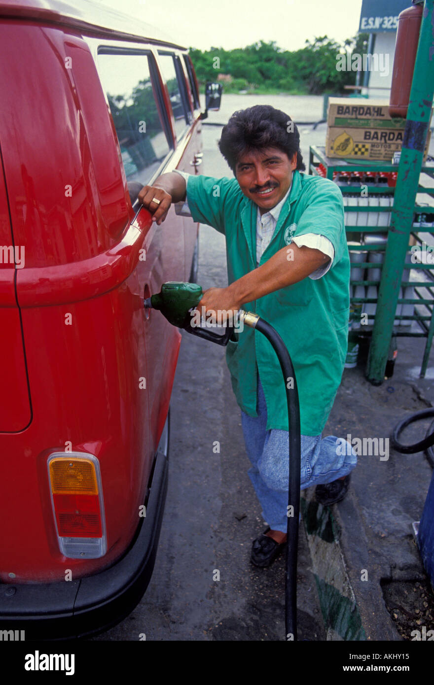 1 one Mexican man, pumping gas, gas pump, Pemex gas station, gas