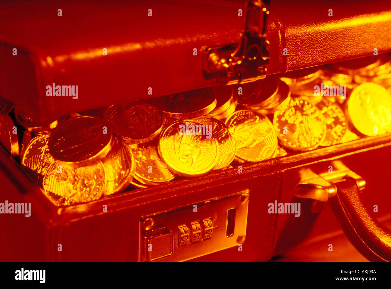 Briefcase full of gold coins Stock Photo Alamy