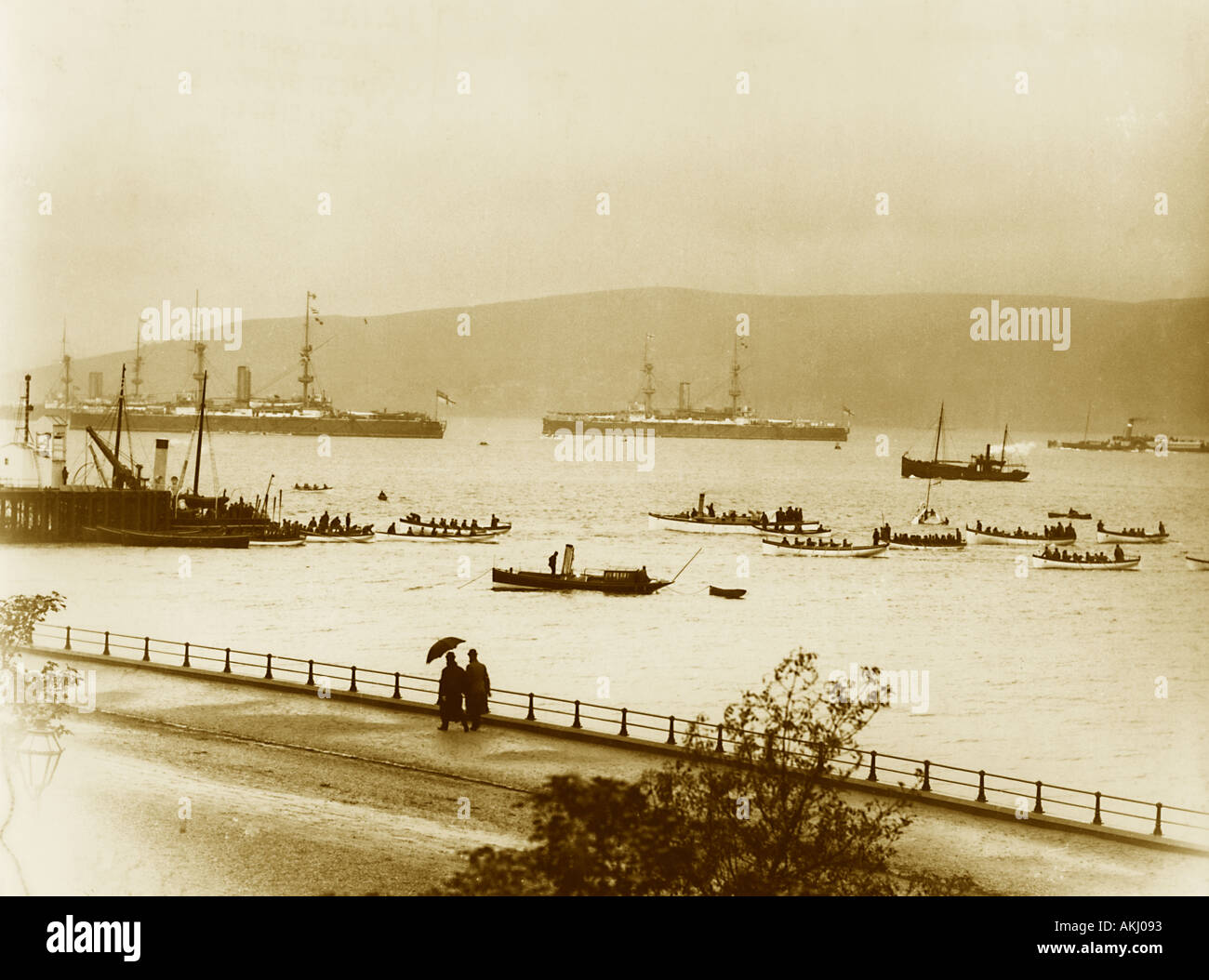 Uk Scotland Greenock the Esplanade and Firth of Clyde with Royal Navy warships during the 1890 s Stock Photo