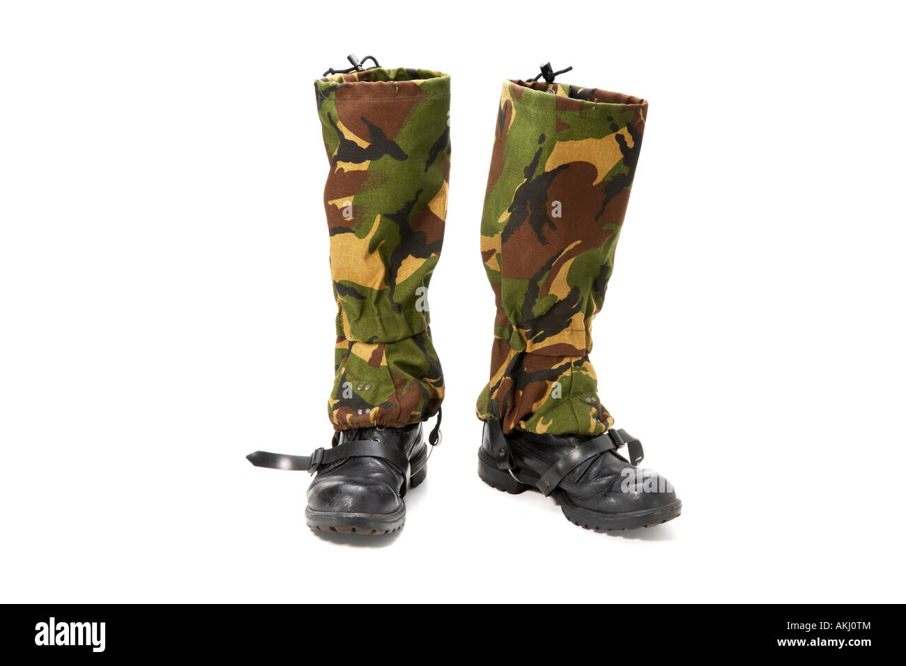 Camouflage gaiters and black leather boots Stock Photo