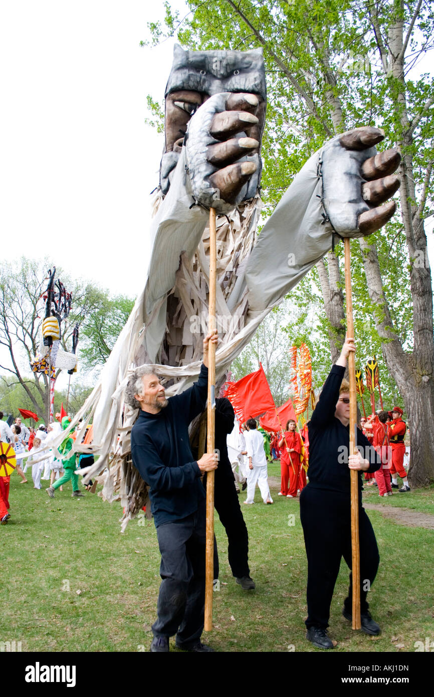 Puppeteers performing with puppets Tree of Life Ceremony. MayDay Parade and Festival Powderhorn Park. Minneapolis Minnesota USA Stock Photo