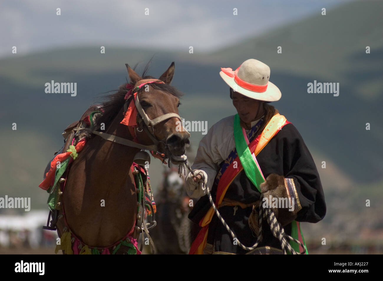 Khampas the warrior horseman of old Tibet compete at the Litang Horse Festival Kham Sichuan Province China Tibet  Stock Photo