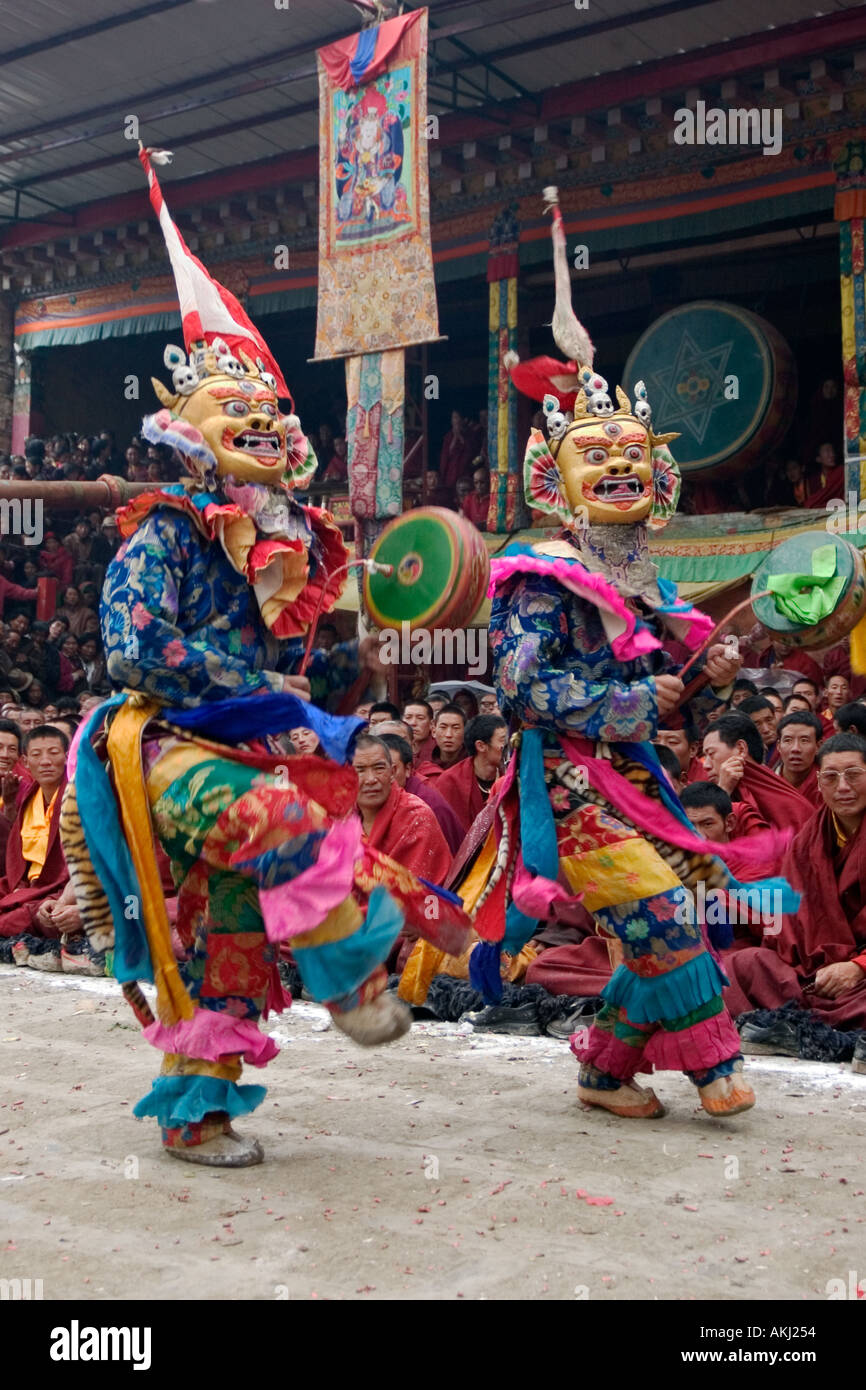 Masked dancers with skulls representing impermanence at the Cham dances