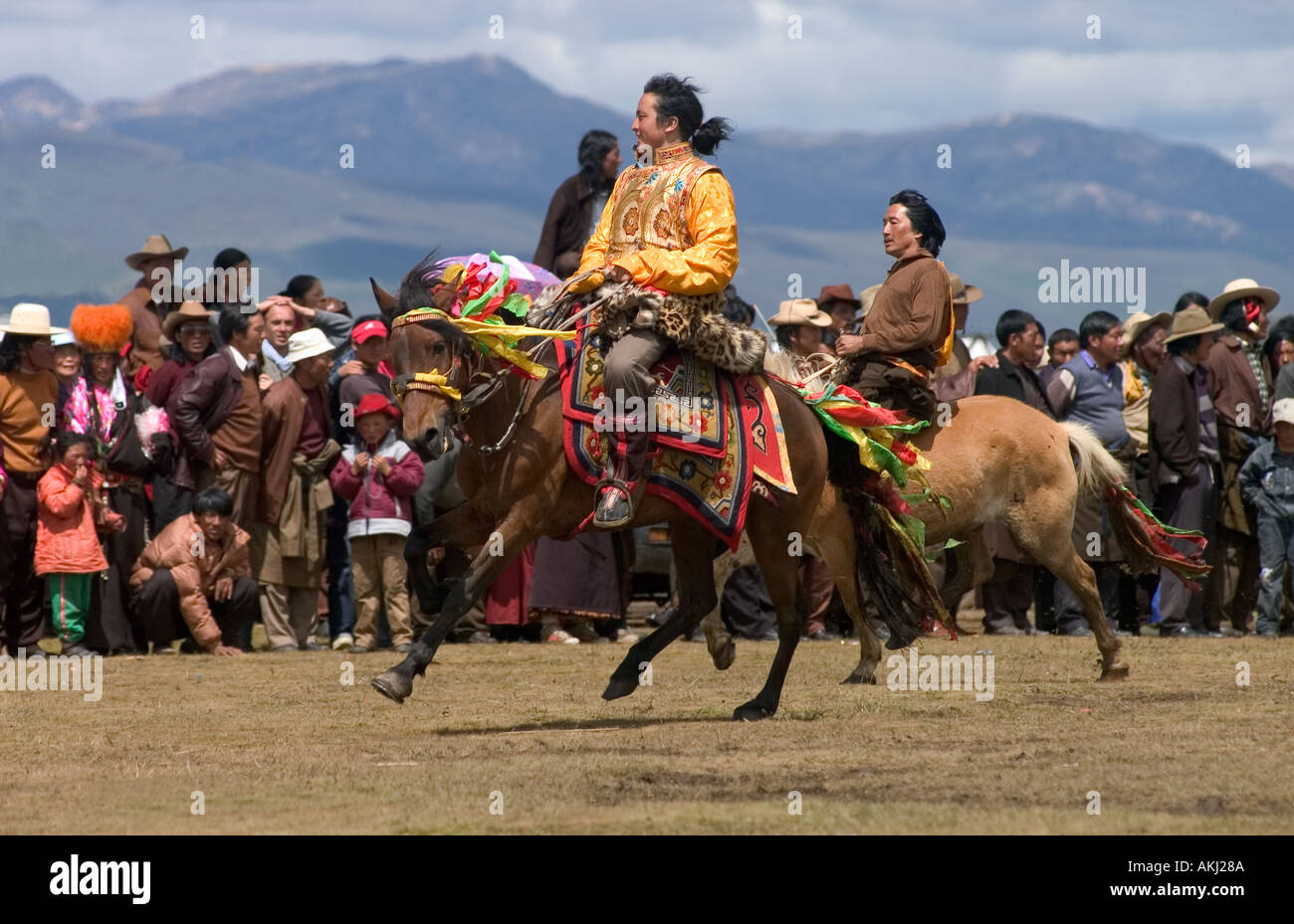 A Khampa participates in the dressage competition at the Litang Horse Festival in Kham Sichuan Province China Tibet  Stock Photo