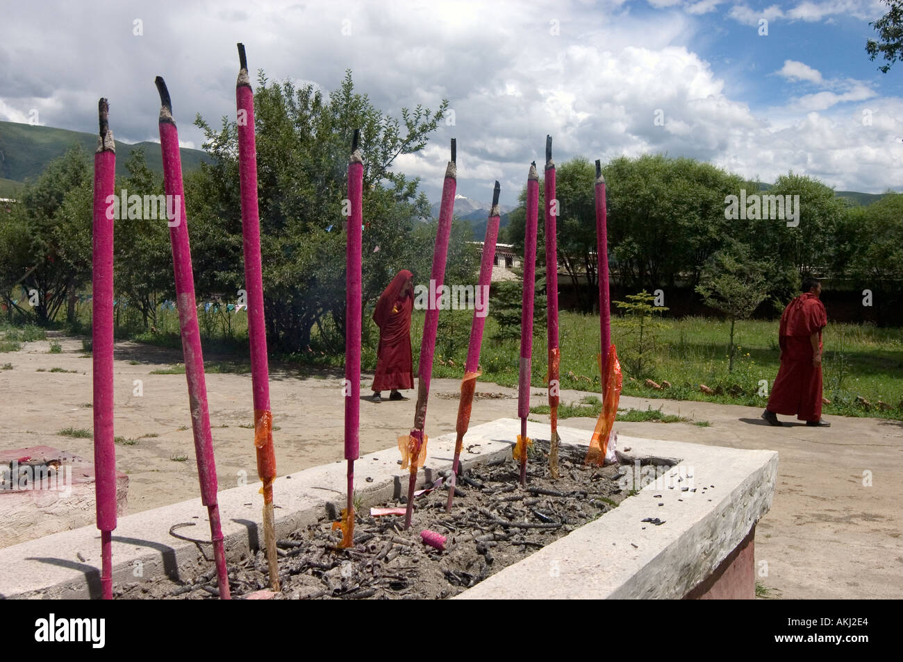 Incense burns in front of a temple at Dhokham Garther Monastery Kham Sichuan Province China Tibet  Stock Photo