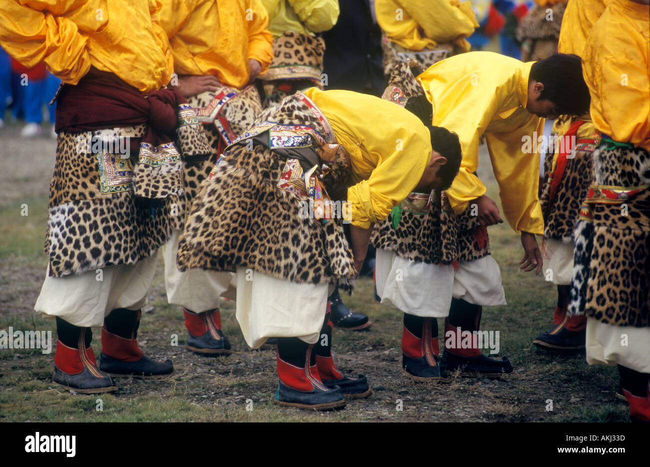 Dance troop with leopard skin costumes represent a region of Kham Litang Horse Festival Sichuan Province China Stock Photo