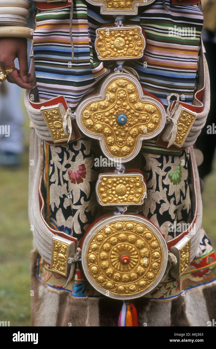 Detail of traditional female Khampa wearing gold silver gau boxes at the Litang Horse Festival Sichuan Province China Stock Photo