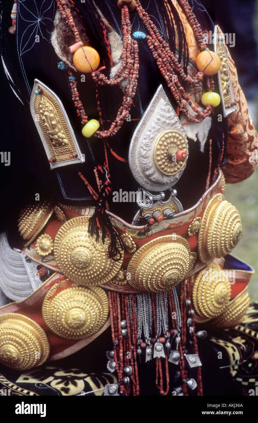 Detail of traditional female Khampa wearing gold coral hair pieces at the Litang Horse Festival Sichuan Province China Stock Photo