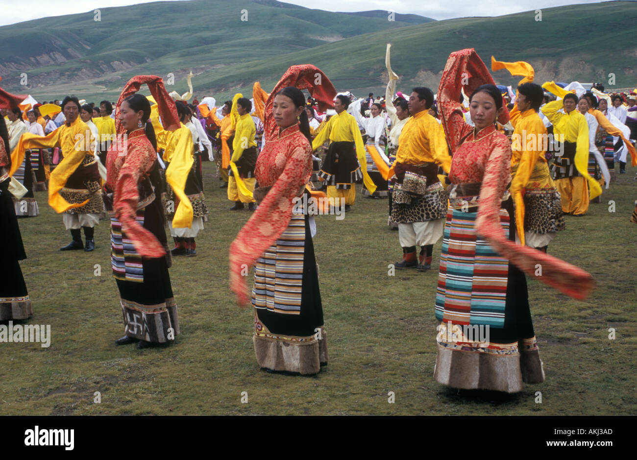 Dance troops preform at the Litang Horse Festival representing various regions of Kham Sichuan Province China Tibet  Stock Photo