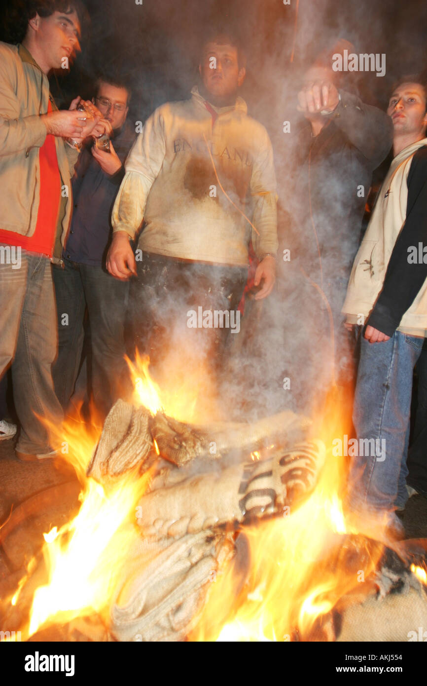 tar barrelling ottery st marys devon uk a finished barrel with gloves burning on top Stock Photo