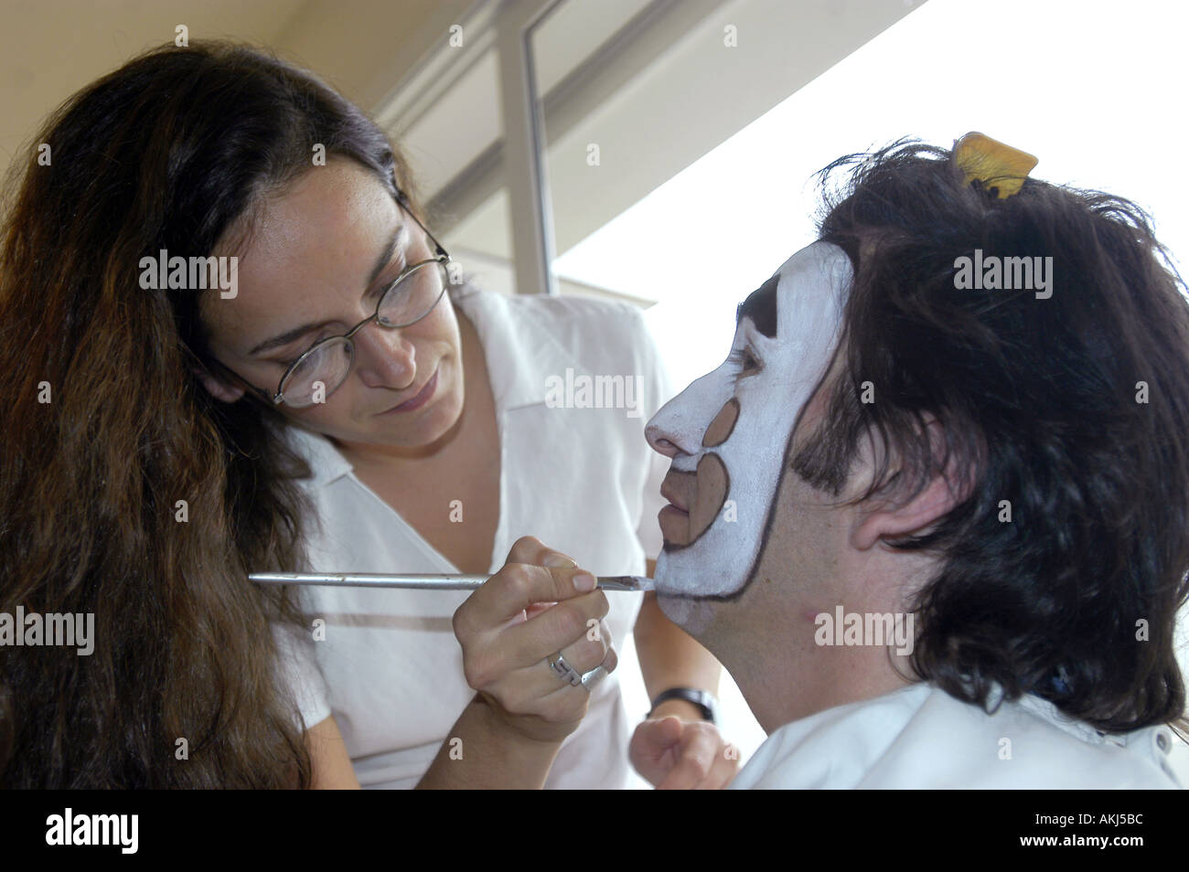 A clown being made up before a performance Stock Photo