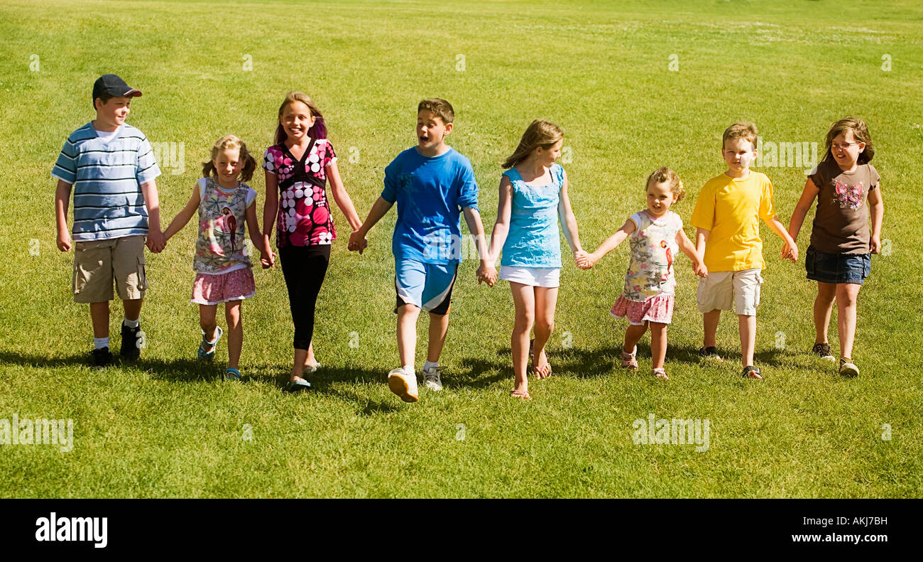 Front view of children walking Stock Photo - Alamy