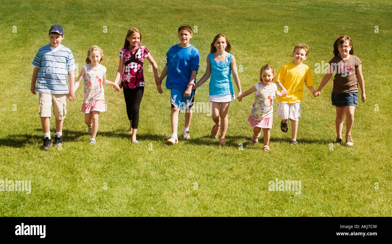 Front view of children walking Stock Photo - Alamy