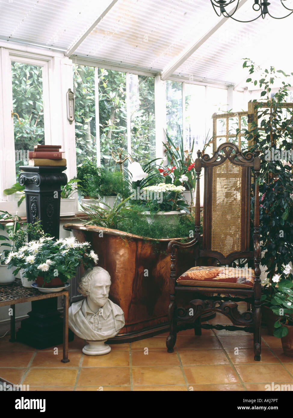 Classical Bust Beside Antique Chair In Conservatory With