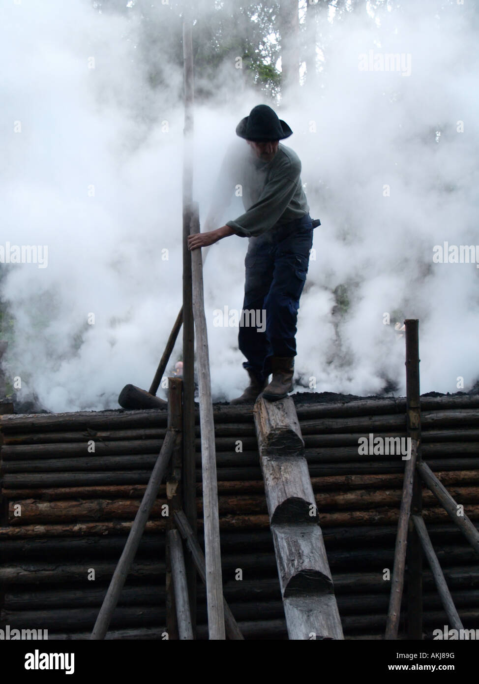Making char coal Stock Photo Alamy