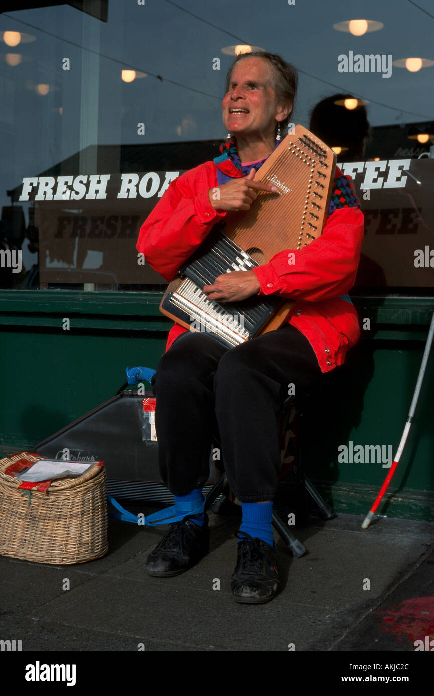 Sidewalk musician playing autoharp Stock Photo Alamy