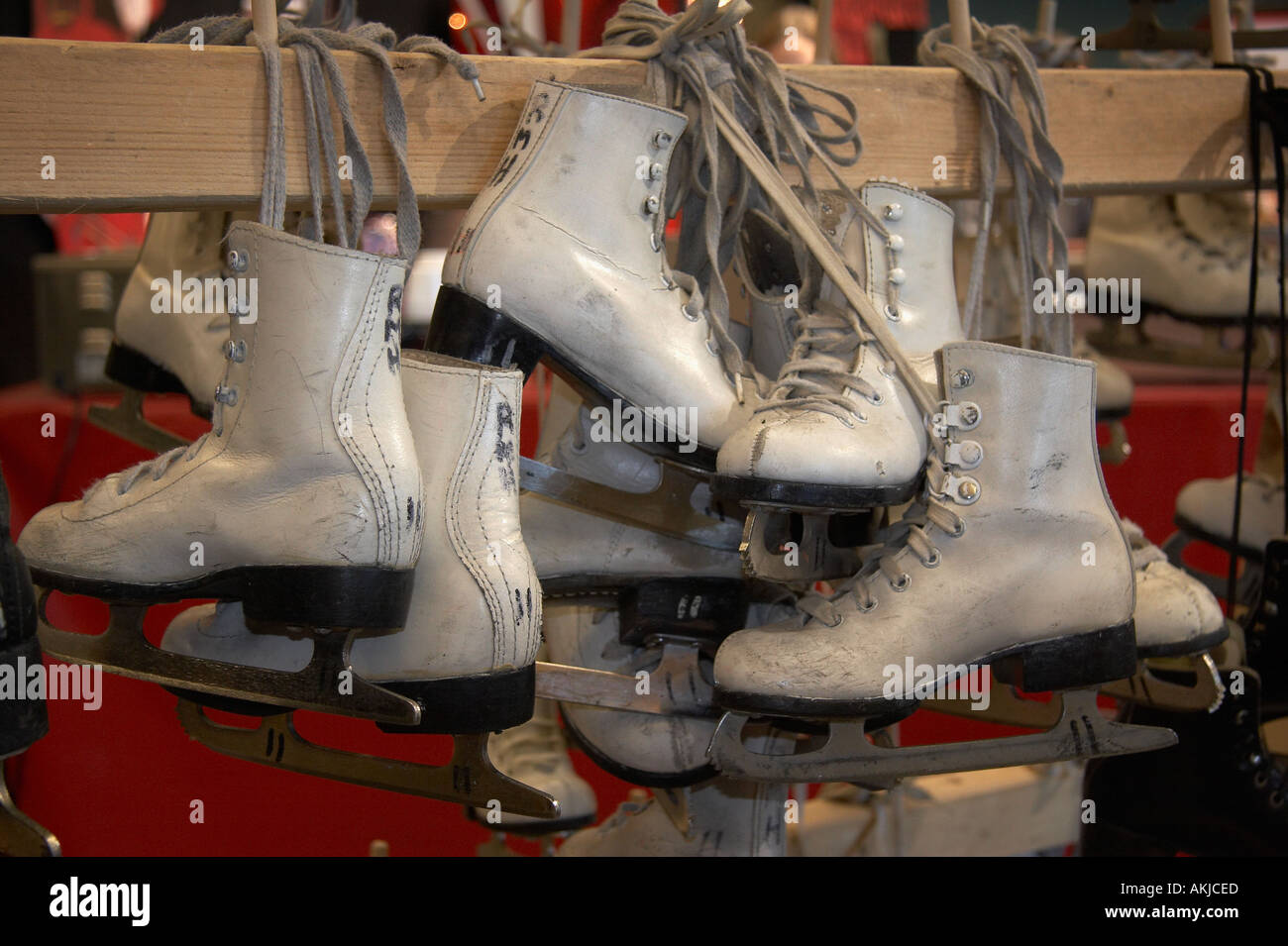 Ice skates hanging on rack at ice skating rink Stock Photo Alamy