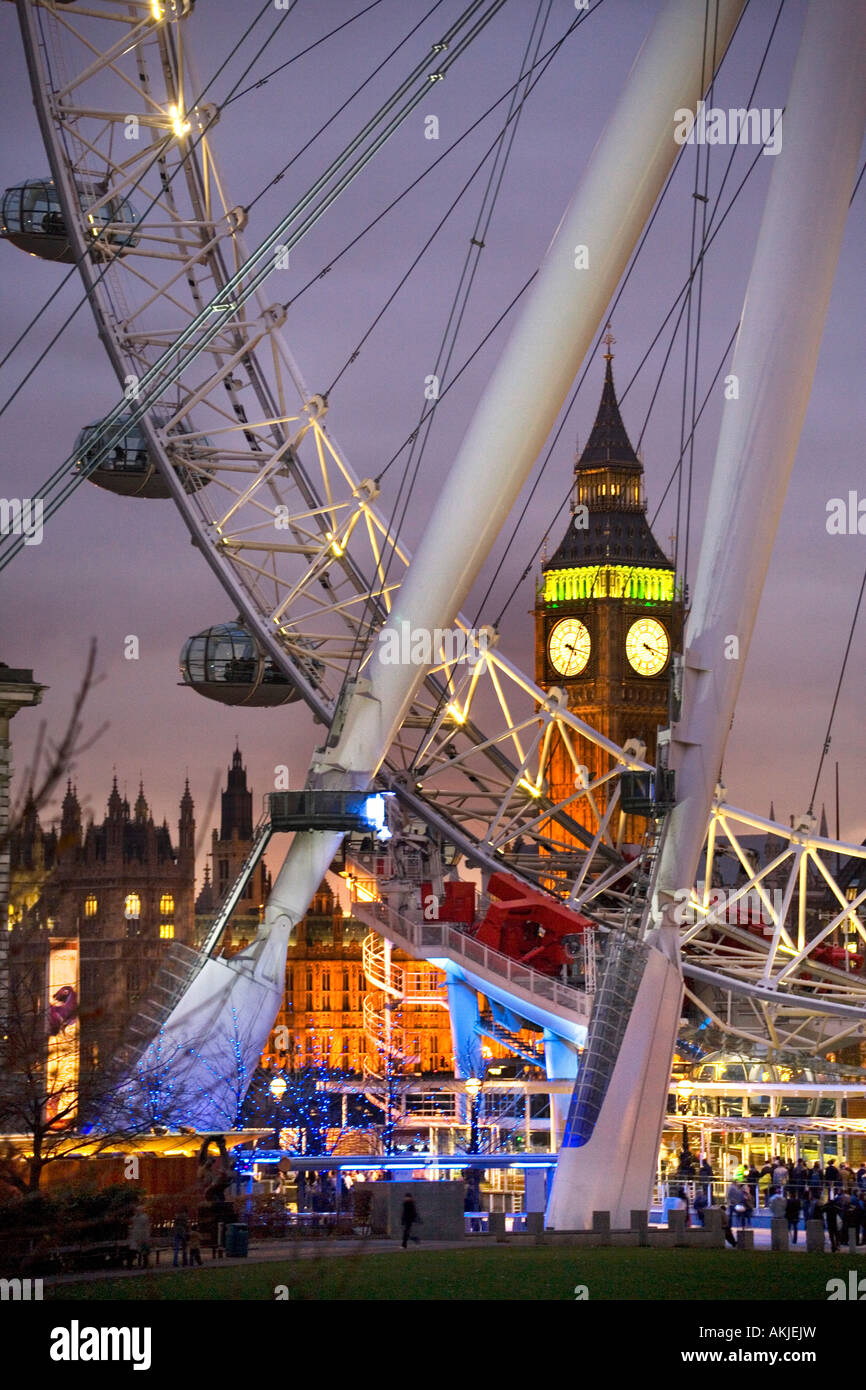 London eye wheel and houses of parliament at night. Stock Photo