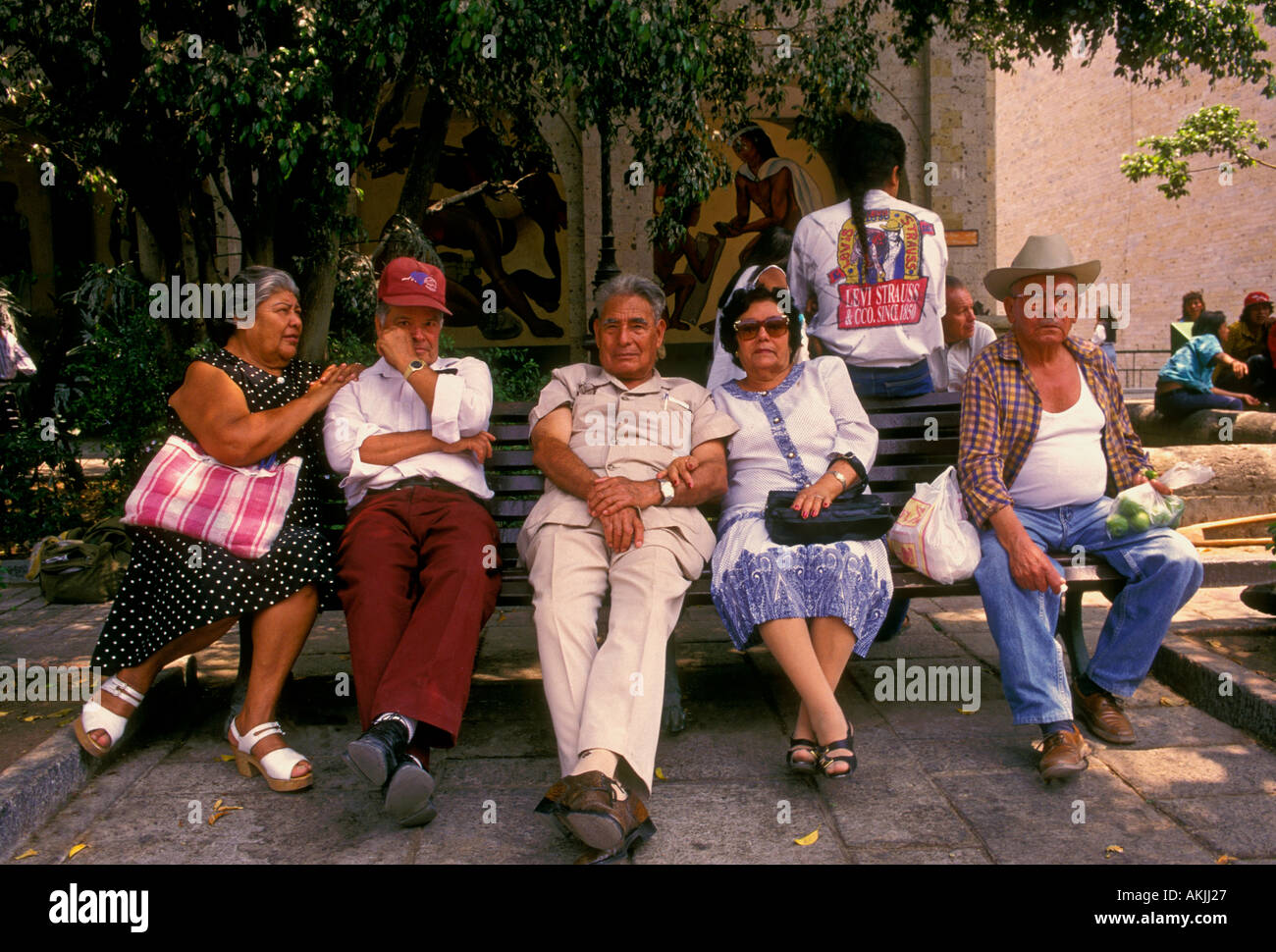 Mexican people. Mexican men, Mexican women, senior citizens, seniors,  friends, sitting on bench, Hidalgo Gardens, Tlaquepaque, Jalisco State, Mexico Stock Photo