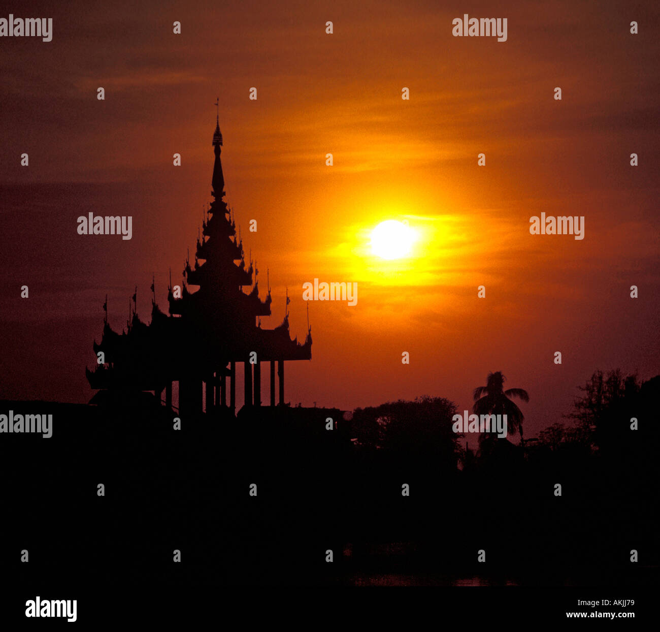 Sunset over Ornate Pagoda in Mandalay, Burma Stock Photo