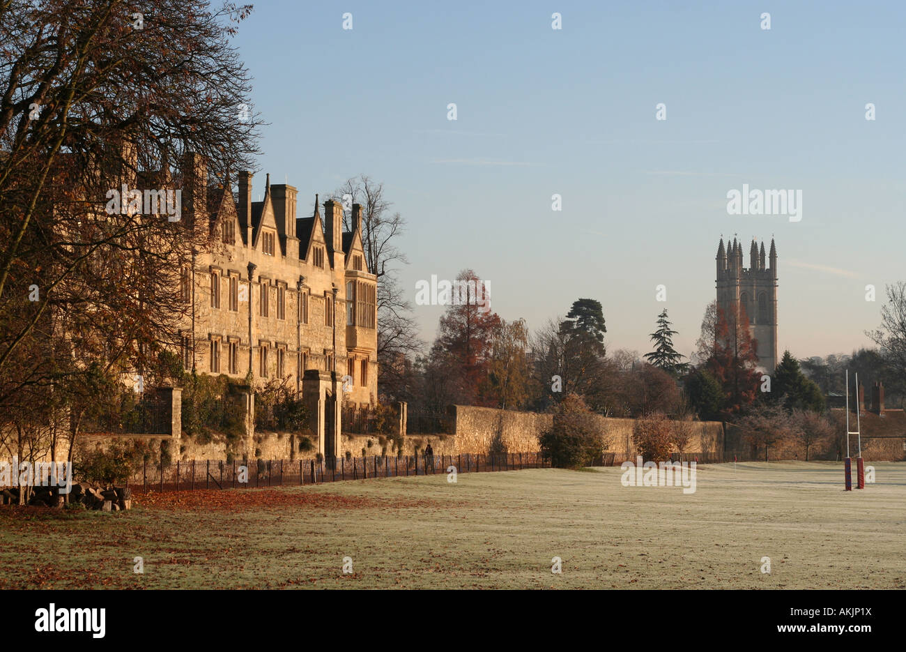Merton College viewed from Christ Church Meadow on a frosty autumnal morning with Magdalen Tower, Oxford University, Oxford, UK Stock Photo