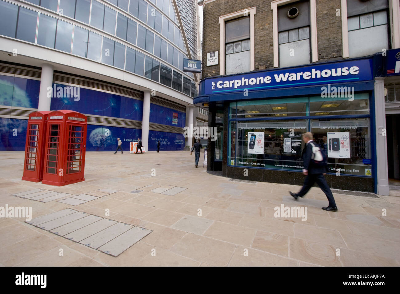 Carphone Warehouse mobile telephone and telecoms outlet Central London with red phone boxes Stock Photo