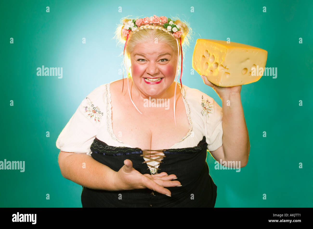Woman in Germanic costume with cheese wedge Stock Photo