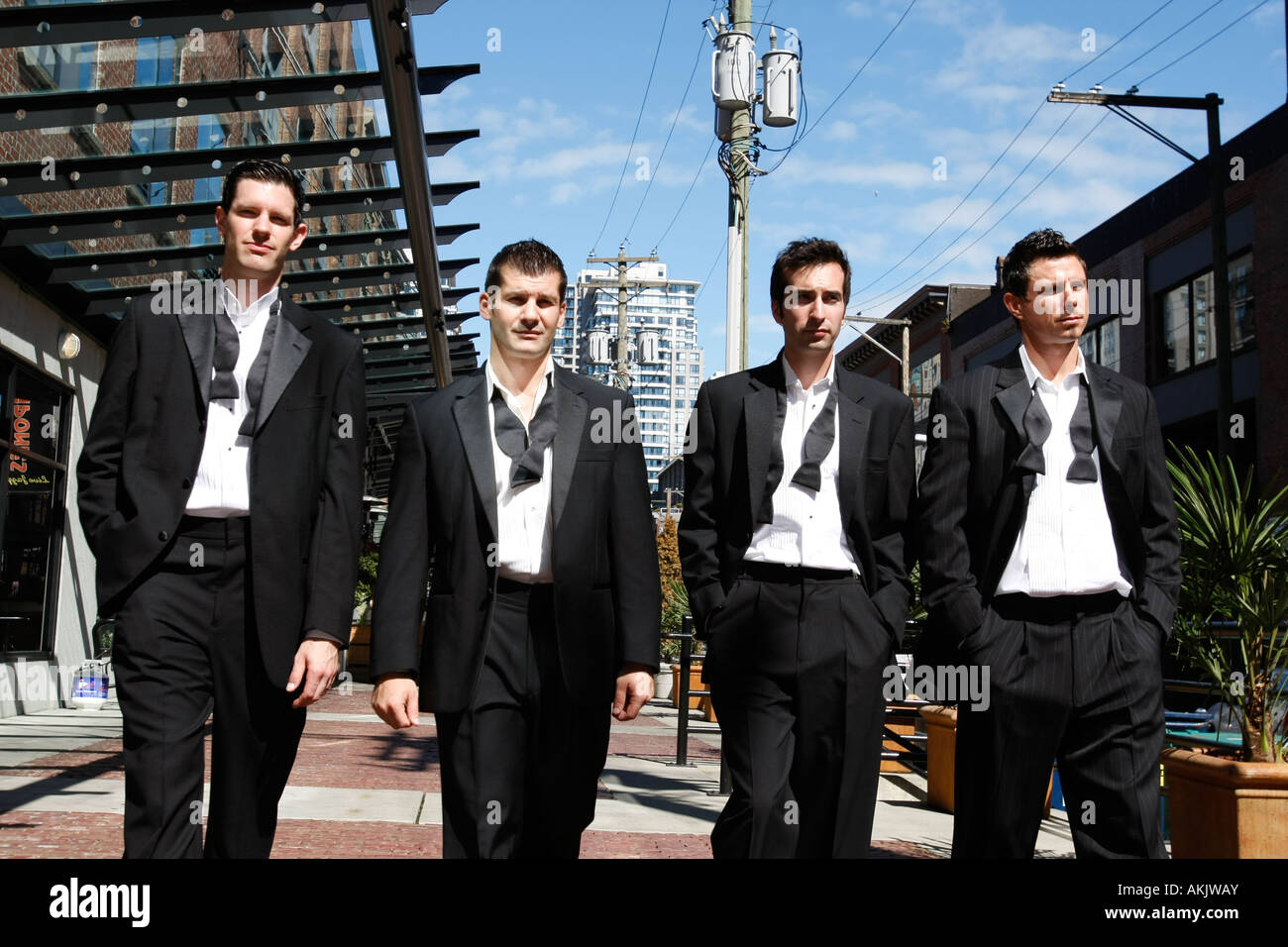 groom in a tuxedo with his grooms men on his wedding day Stock Photo ...