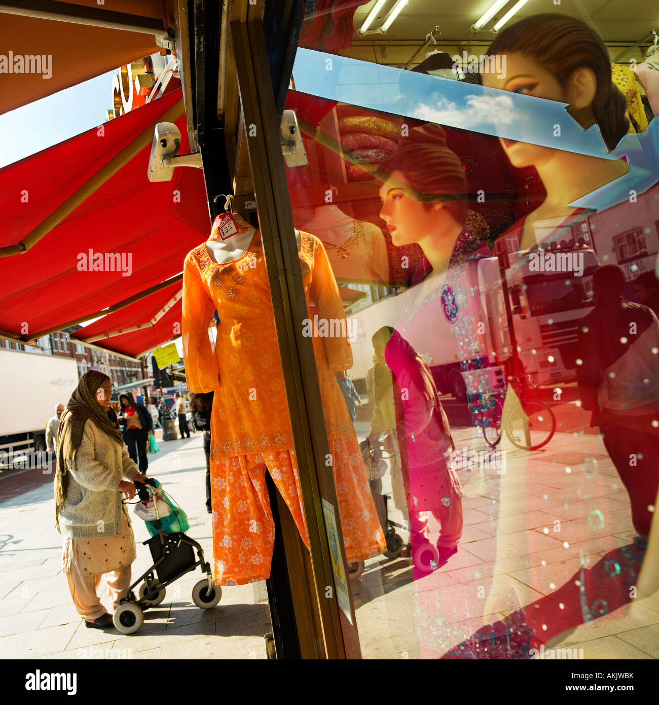 Indian woman in shop with pink sari hires stock photography and images Alamy