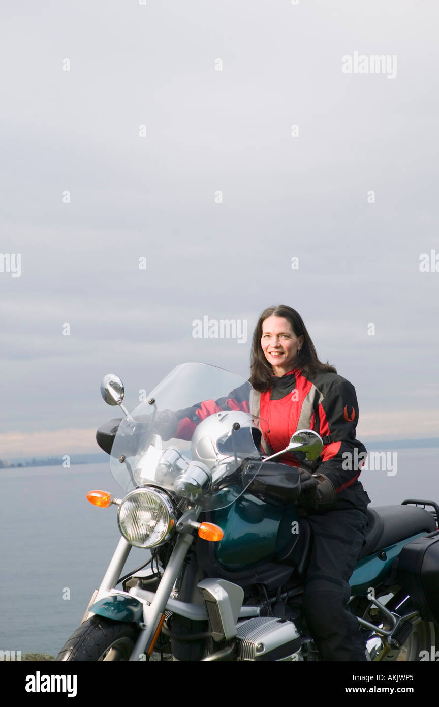 Woman posing on motorcycle Stock Photo