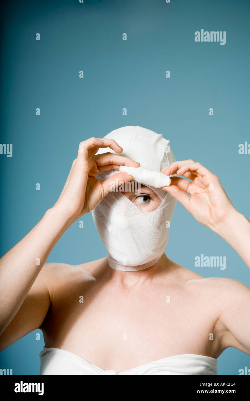 Woman head wrapped in bandage hi-res stock photography and images - Alamy
