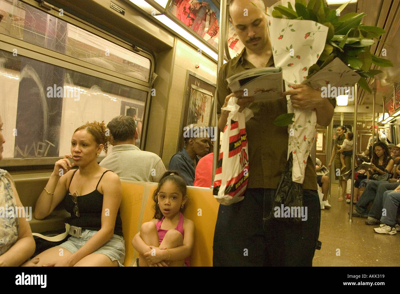 A typical scene on a New York City subway car Stock Photo - Alamy