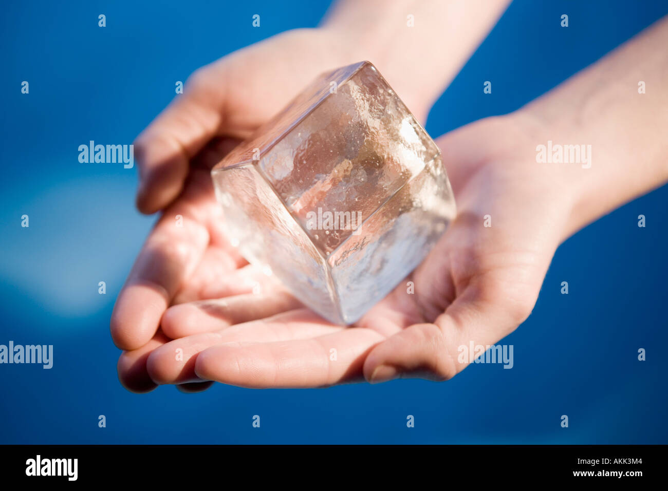 https://c8.alamy.com/comp/AKK3M4/close-up-of-hand-holding-ice-cube-AKK3M4.jpg