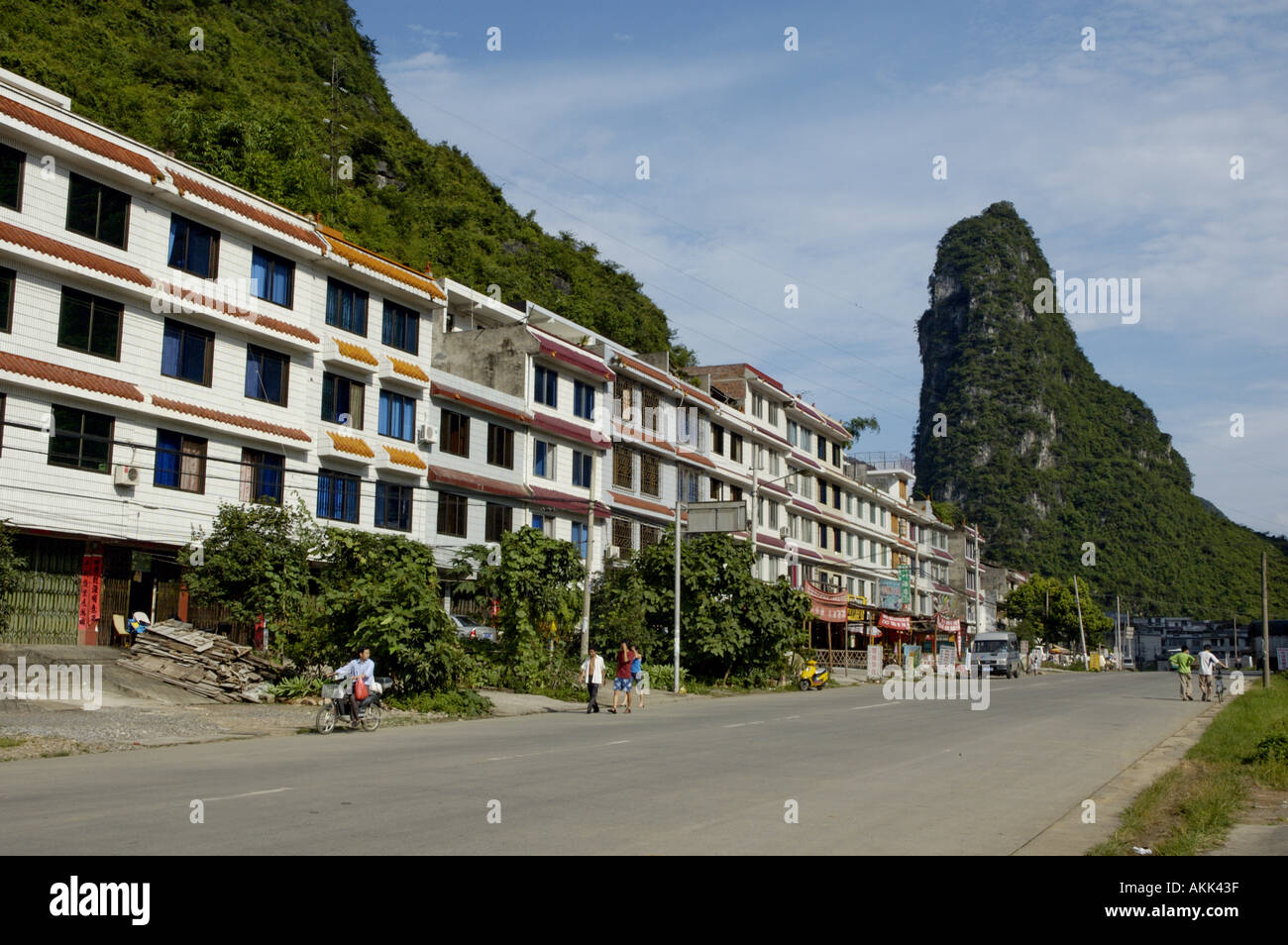 Apartment buildings along the road leading to downtown Yangshuo, Guangxi, China. Stock Photo