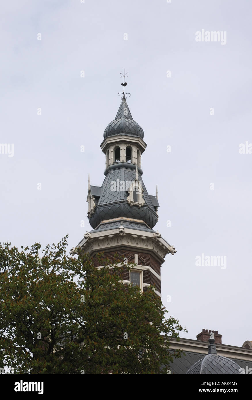 Octagonal brick tower topped by an ornate cupola with an onion shaped