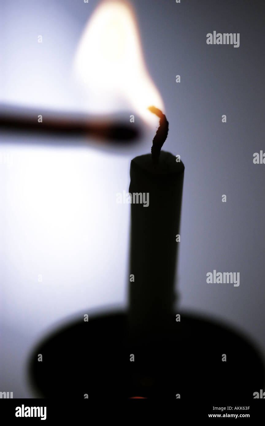 Match lighting a candle Stock Photo Alamy
