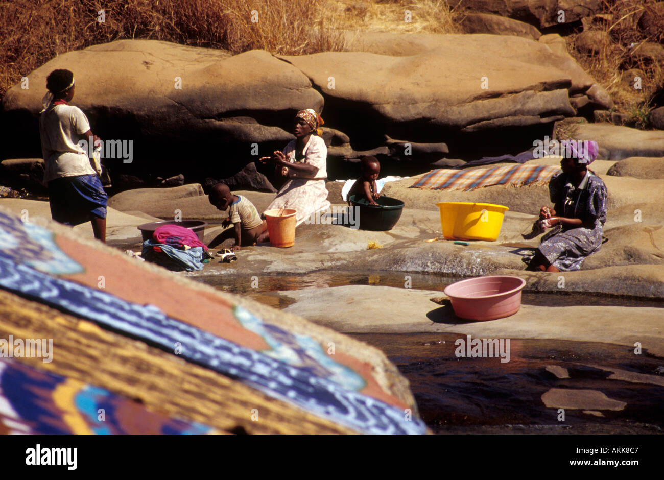 Scenic landscape of women washing clothes outdoors South Africa Stock Photo