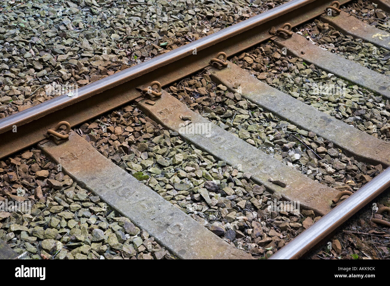 Railway tracks with clips and concrete sleepers Stock Photo Alamy