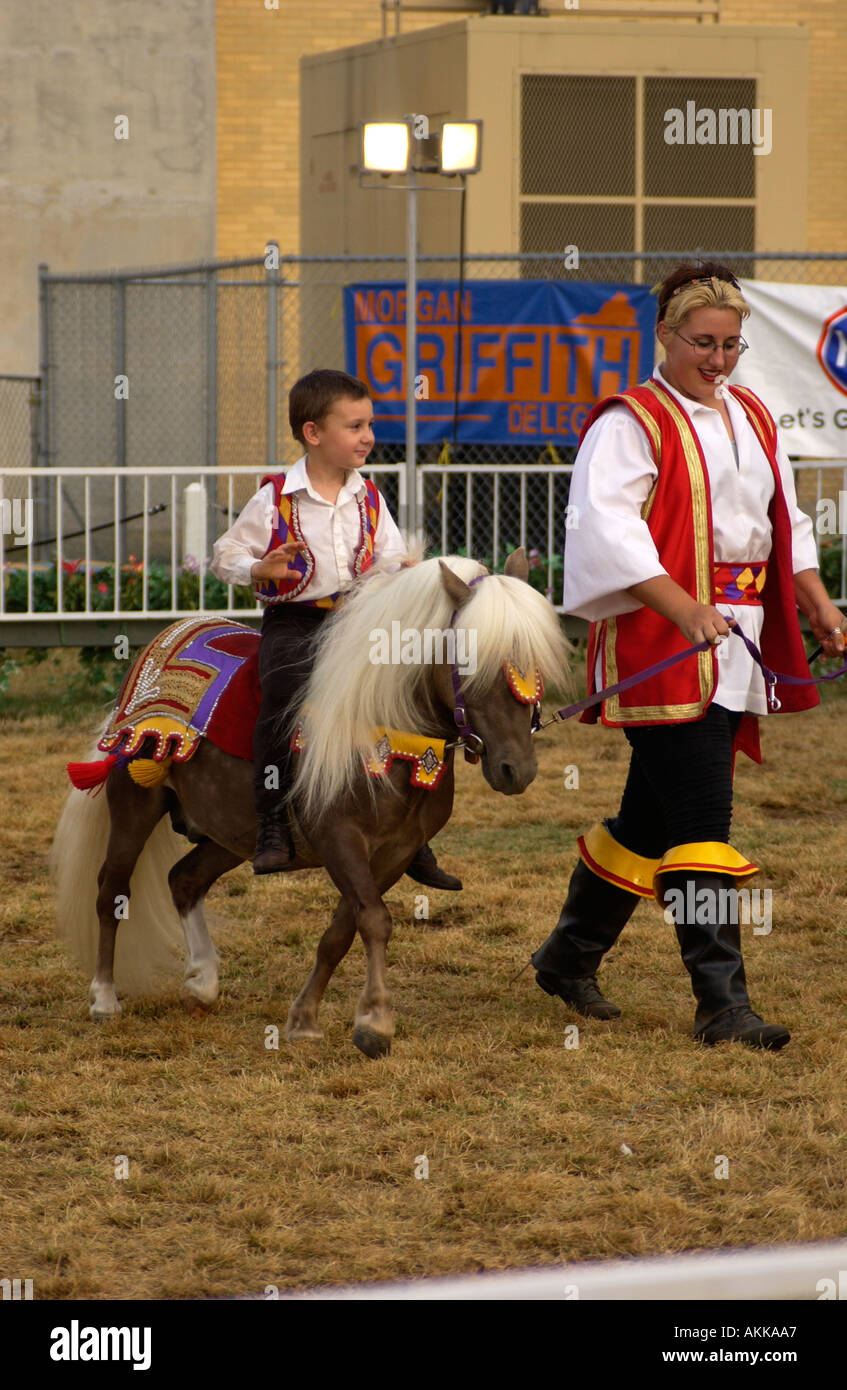 Download Small Boy Riding Pony In A Show At The Fair Stock Photo Alamy