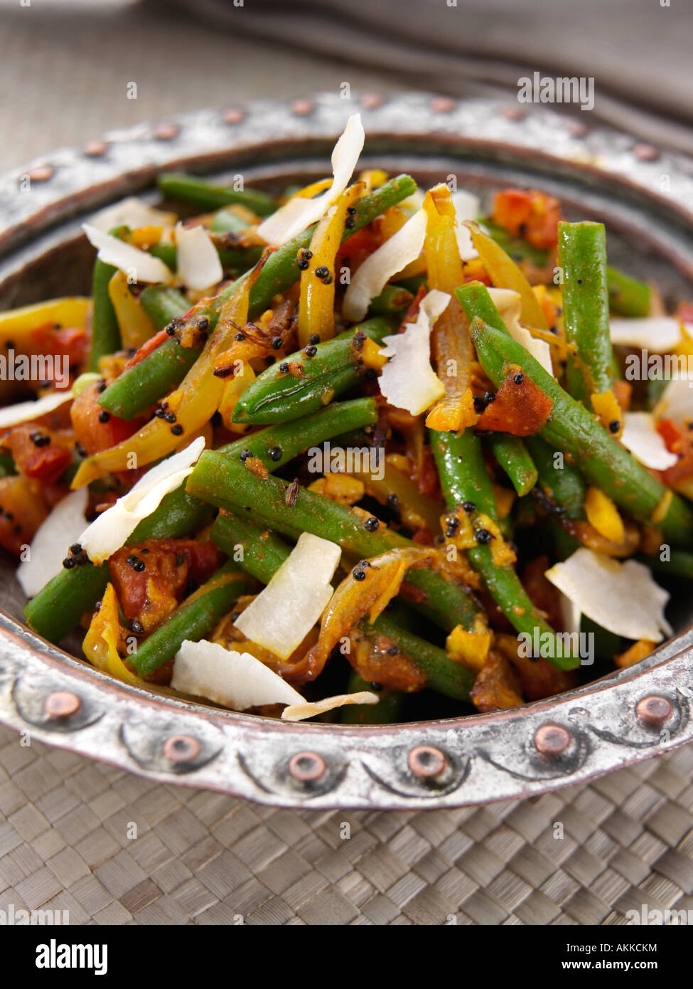 A dish of Indian spicy green beans with coconut vegetarian editorial