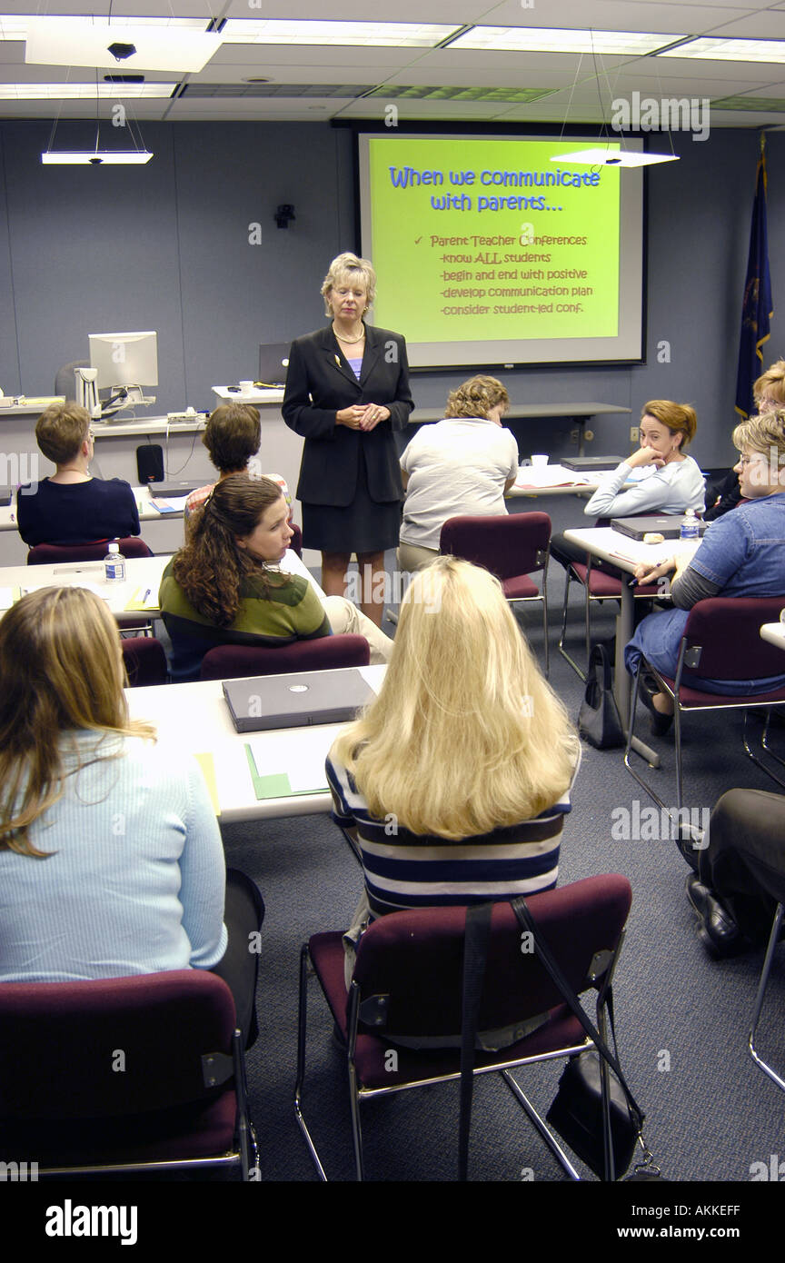Female presenter gives Power Point presentation to a group of