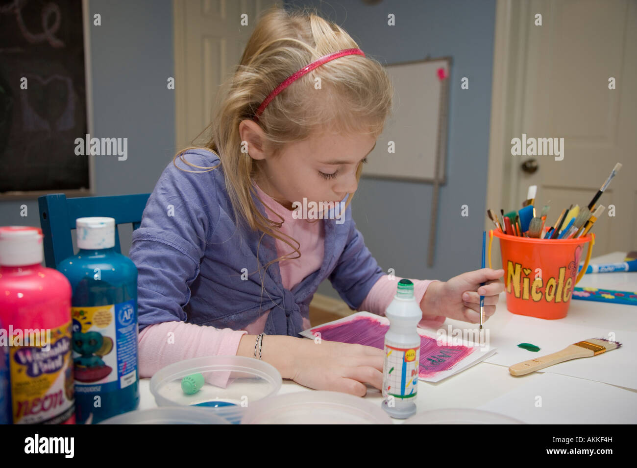 Child painting a picture Stock Photo Alamy