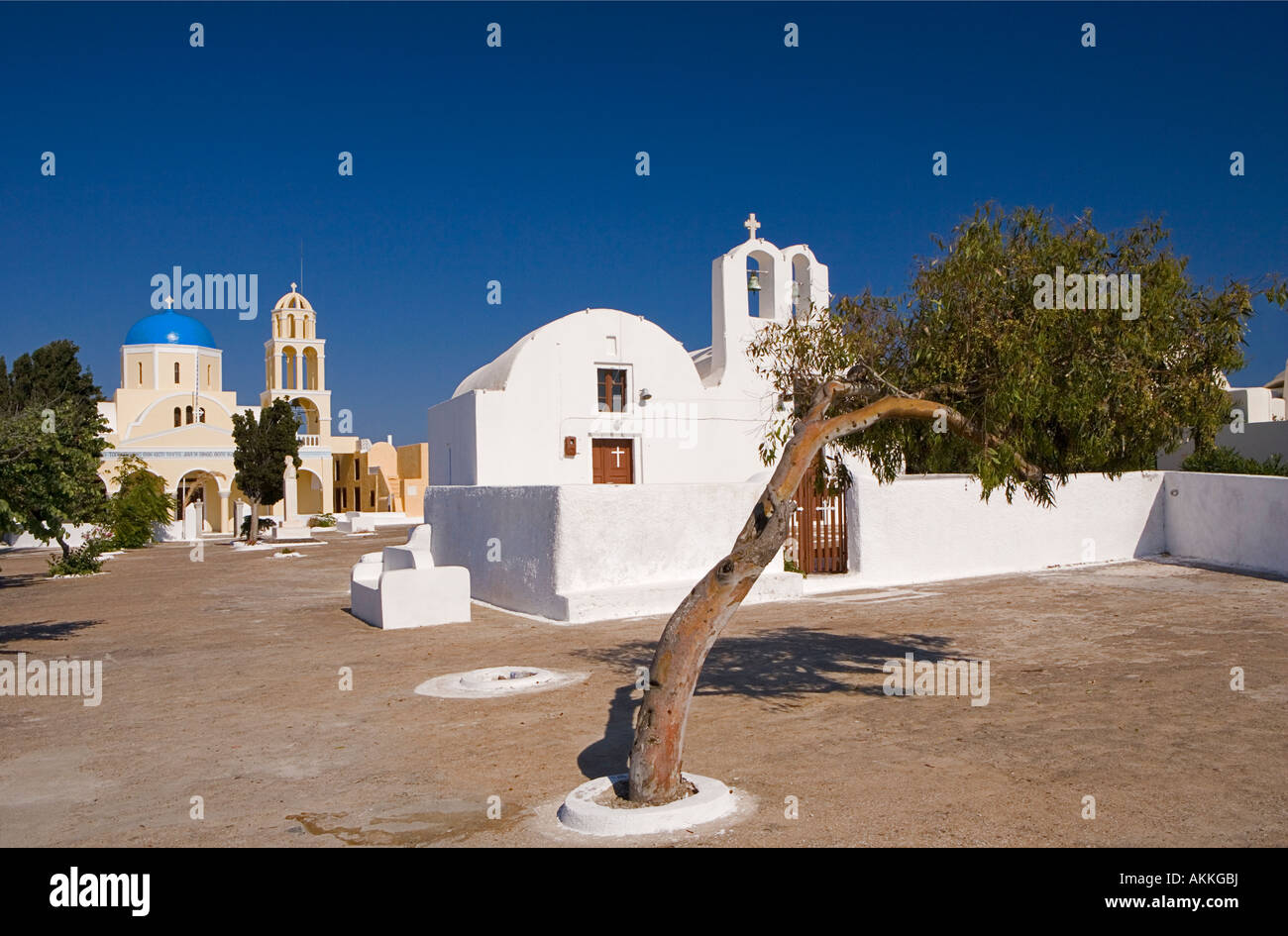 Contrasting styles of Churches Oia Santorini Greece Stock Photo