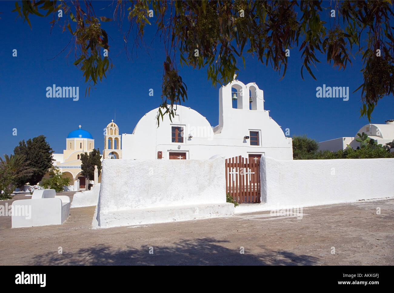 Contrasting styles of Churches Oia Santorini Greece Stock Photo