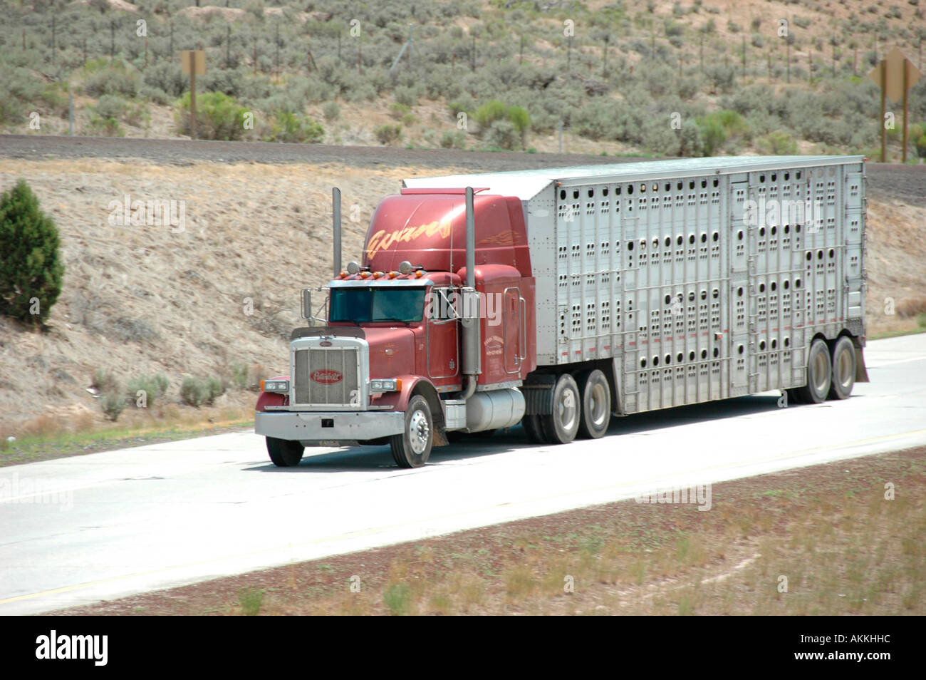 Commercial trucks hauling freight on interstate highway in Utah with