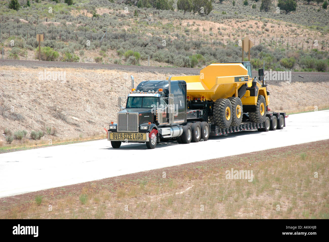 Commercial trucks hauling freight on interstate highway in Utah with