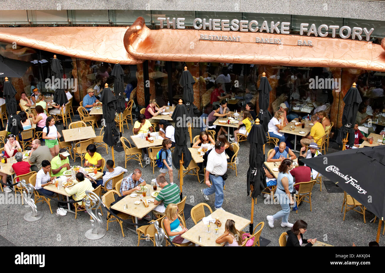 STREET SCENE Chicago Illinois Outdoor dining at Cheesecake Factory along Michigan Avenue Hancock plaza area Stock Photo