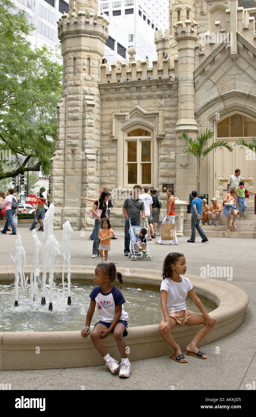 STREET SCENE Chicago Illinois Two African American girls sit by fountain  Water Tower park on Michigan Avenue Stock Photo - Alamy