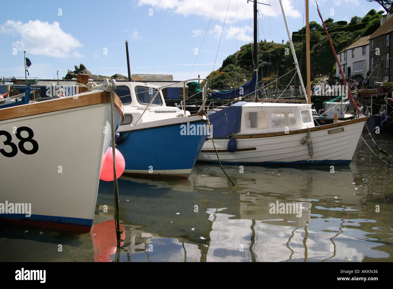 Moored fishing boats Polperro Harbour Cornwall England Summer 2005 Stock Photo