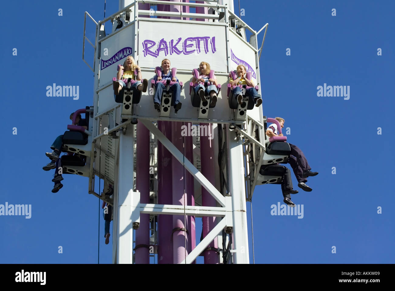 People in an amusement park ride Stock Photo - Alamy